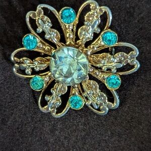 Elegant Gold and Blue Brooch